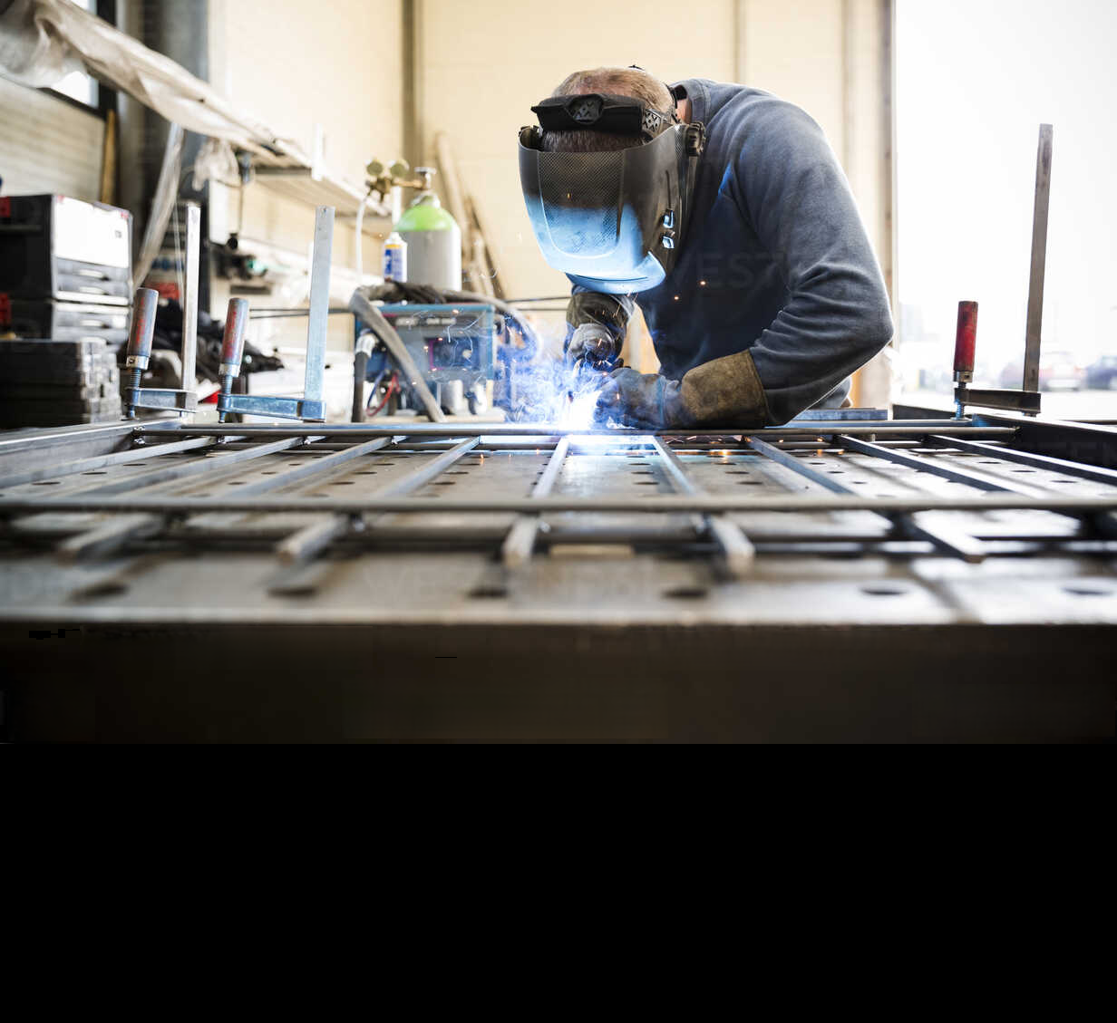metal-construction-welder-welding-railing